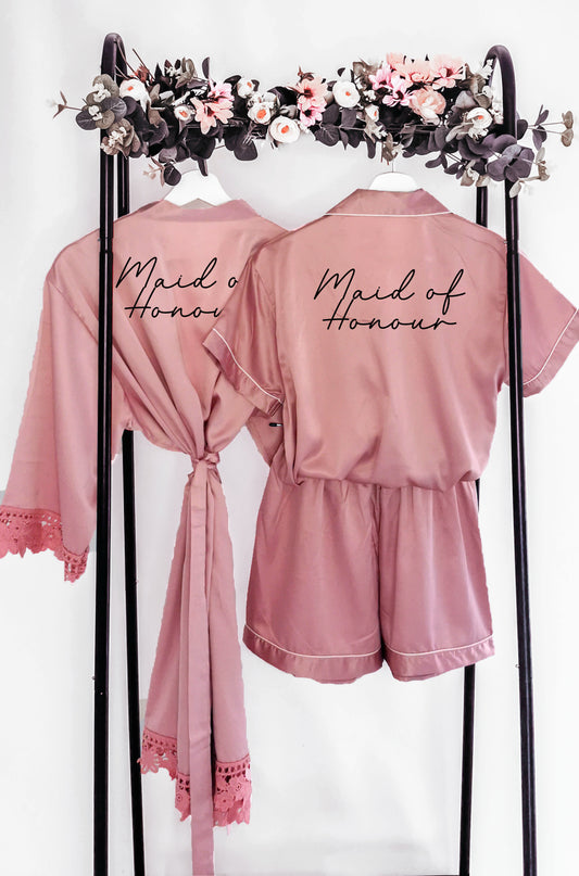 A beautifully crafted personalised wedding robe and pyjama set, featuring an elegant, minimalist font design. Perfect for brides, bridesmaids, and the bridal party, available in various sizes for a chic and timeless look.