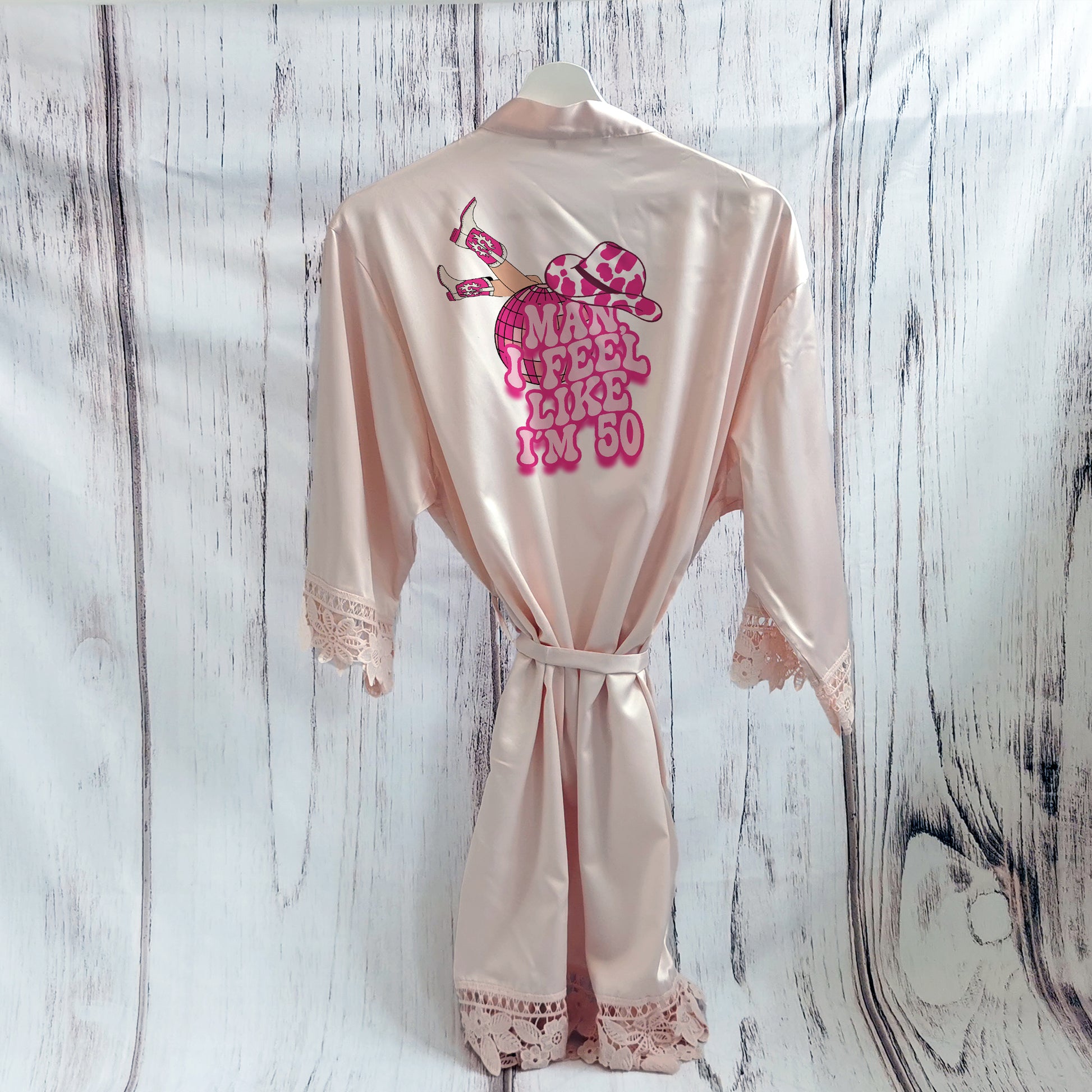 A cowgirl-themed personalised birthday pyjama set, featuring the phrase “Man, I Feel Like I’m (Age)” in a bold western font. The perfect fun and sassy birthday gift, available in luxury satin colours with an optional matching robe.
