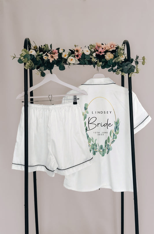 A beautifully designed personalised wedding robe and pyjama set featuring an elegant eucalyptus watercolour design. Perfect for brides, bridesmaids, and the bridal party, available in various sizes for a timeless and sophisticated look.