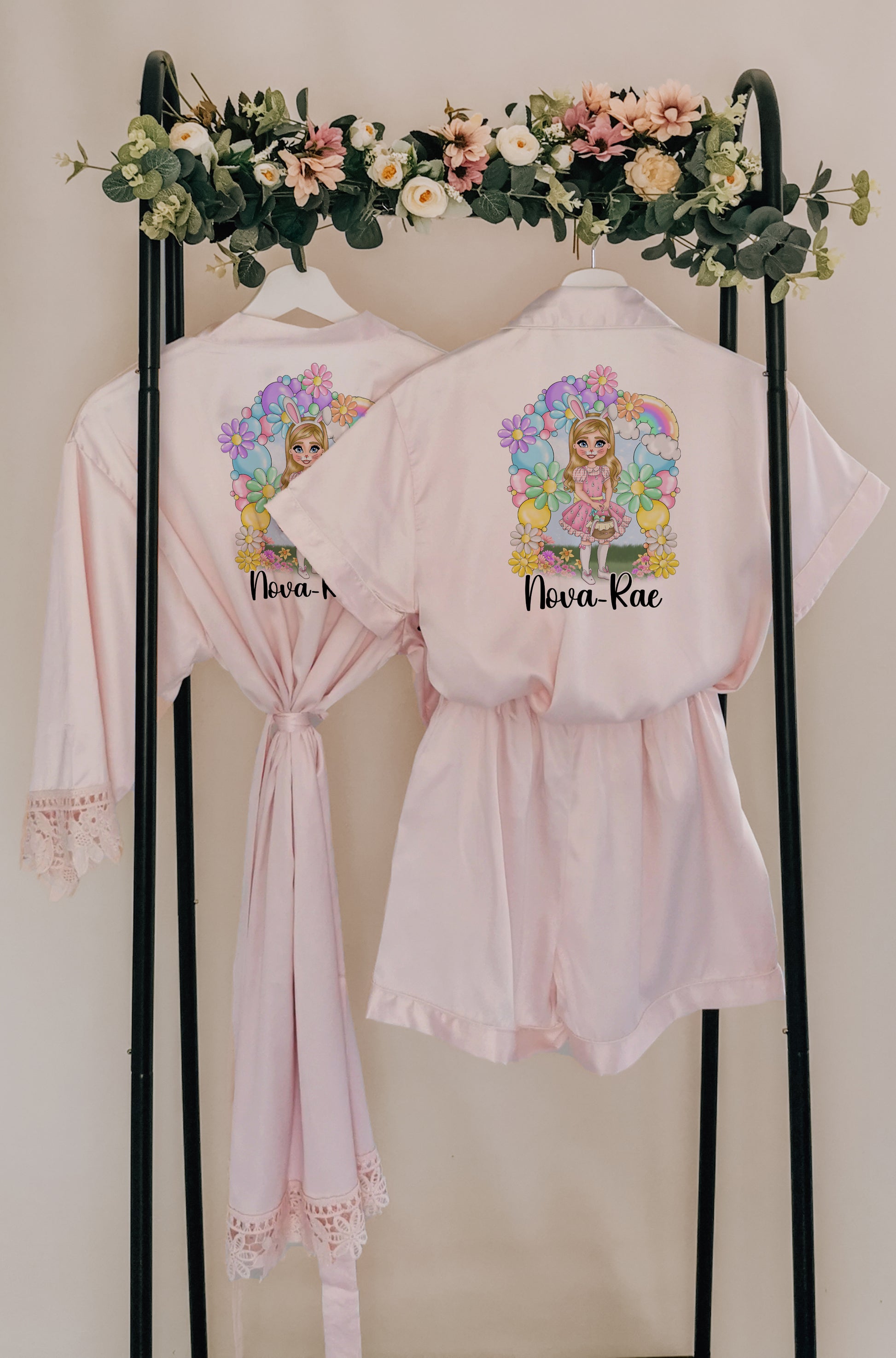 A beautiful personalised Easter pyjama set and robe featuring a custom dollie design, surrounded by pastel flowers and a bunny theme. Includes custom name, hair colour, eye colour, and skin tone for a truly unique touch.

