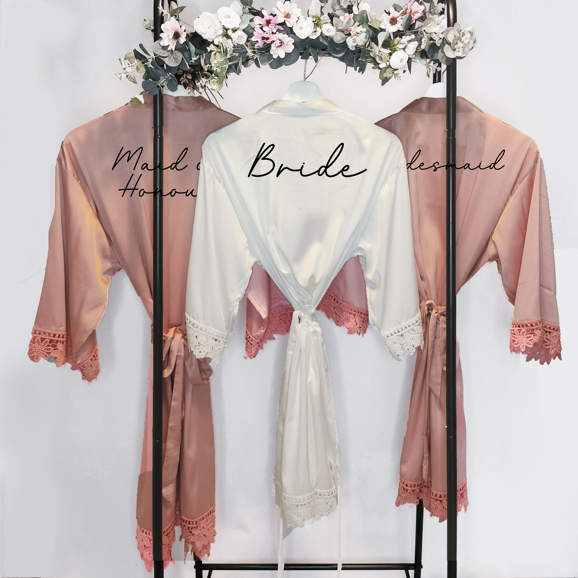 A beautifully crafted personalised wedding robe and pyjama set, featuring an elegant, minimalist font design. Perfect for brides, bridesmaids, and the bridal party, available in various sizes for a chic and timeless look.

