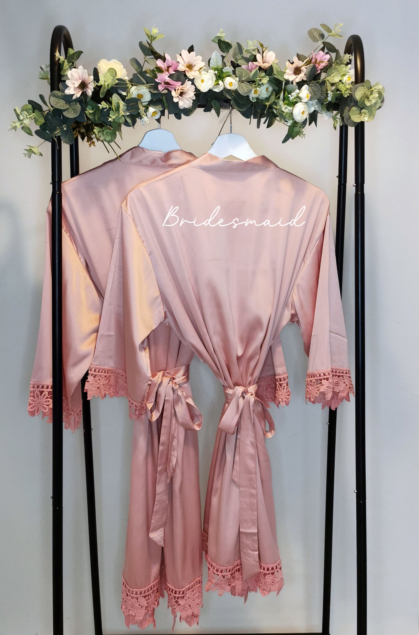 A beautifully crafted personalised wedding robe and pyjama set, featuring an elegant, minimalist font design. Perfect for brides, bridesmaids, and the bridal party, available in various sizes for a chic and timeless look.

