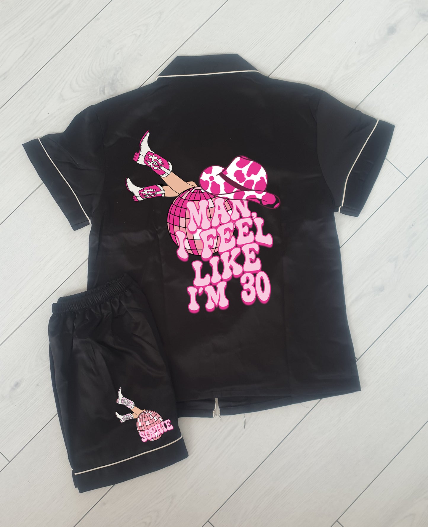 A cowgirl-themed personalised birthday pyjama set, featuring the phrase “Man, I Feel Like I’m (Age)” in a bold western font. The perfect fun and sassy birthday gift, available in luxury satin colours with an optional matching robe.

