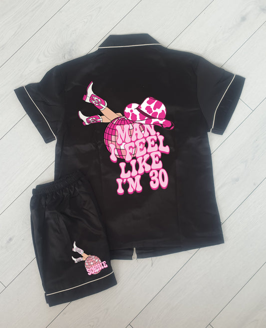 A cowgirl-themed personalised birthday pyjama set, featuring the phrase “Man, I Feel Like I’m (Age)” in a bold western font. The perfect fun and sassy birthday gift, available in luxury satin colours with an optional matching robe.
