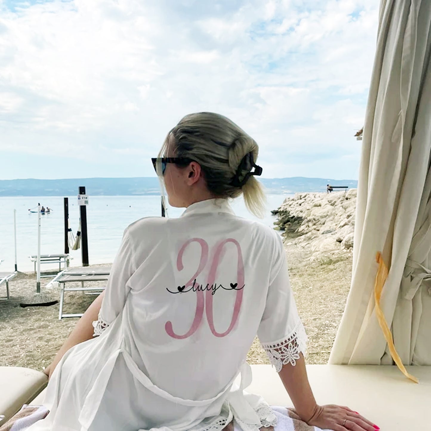 A set of stylish, customized pajamas and robe for a 30th birthday celebration, featuring elegant design elements and the number '30' prominently displayed